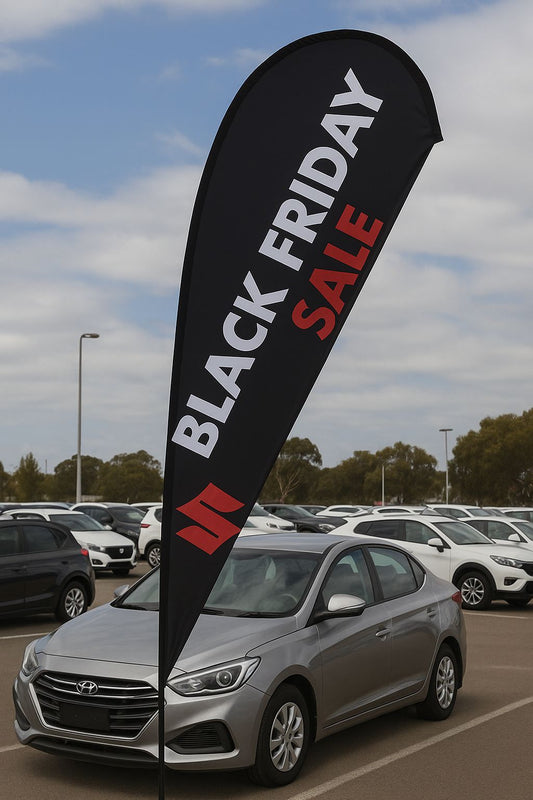 Outdoor advertising teardrop banner for automotive Black Friday promotion