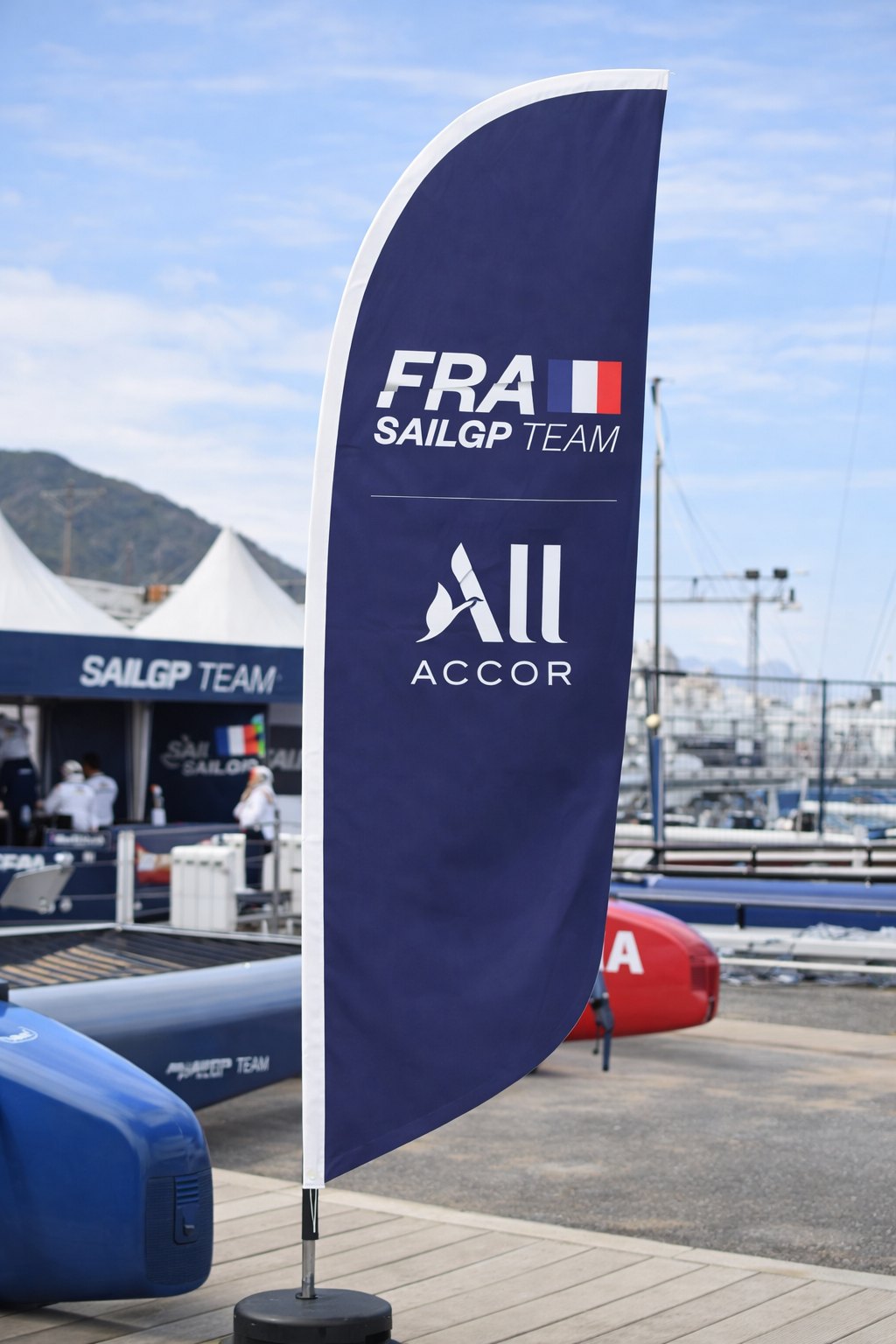 Feather banner vs teardrop banner example at Australian sporting event