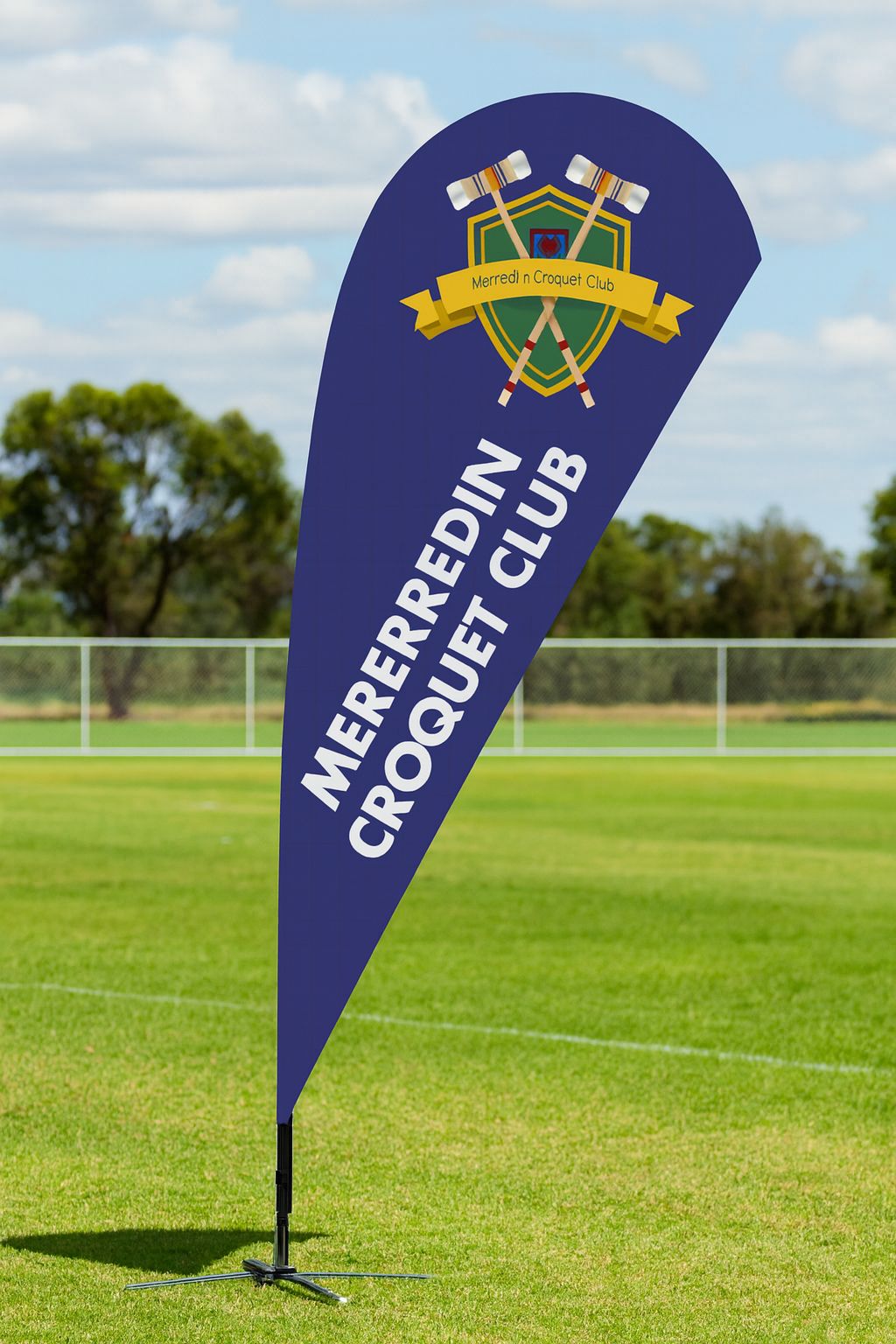 ground spike teardrop flag on sports field