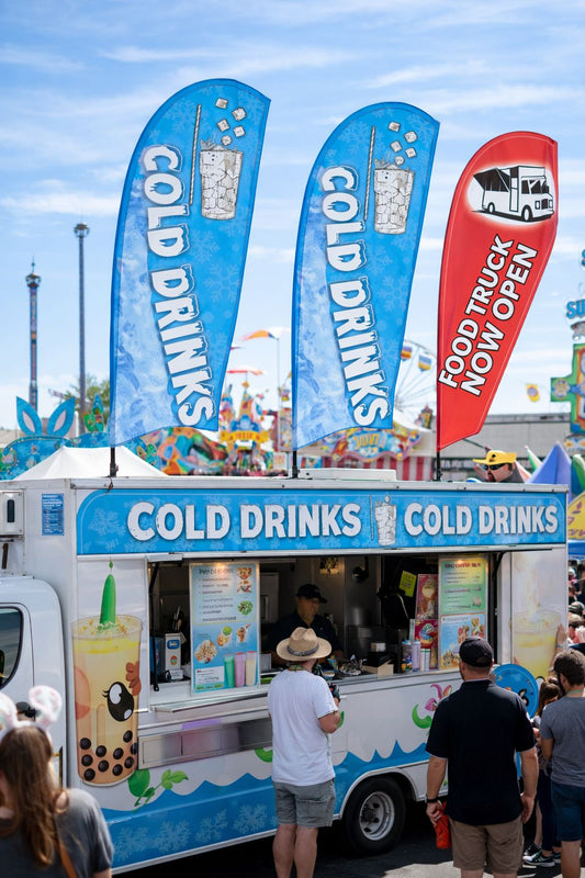 custom teardrop banner Sydney drink stall advertising flags Easter event crowd