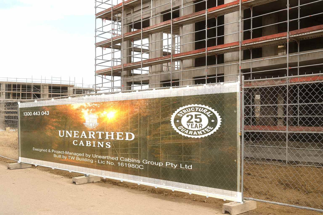 Teardrop banners at construction site entry providing wayfinding and branding for a property development in Australia