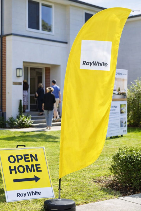 Custom teardrop banner and teardrop flags used at real estate auction day